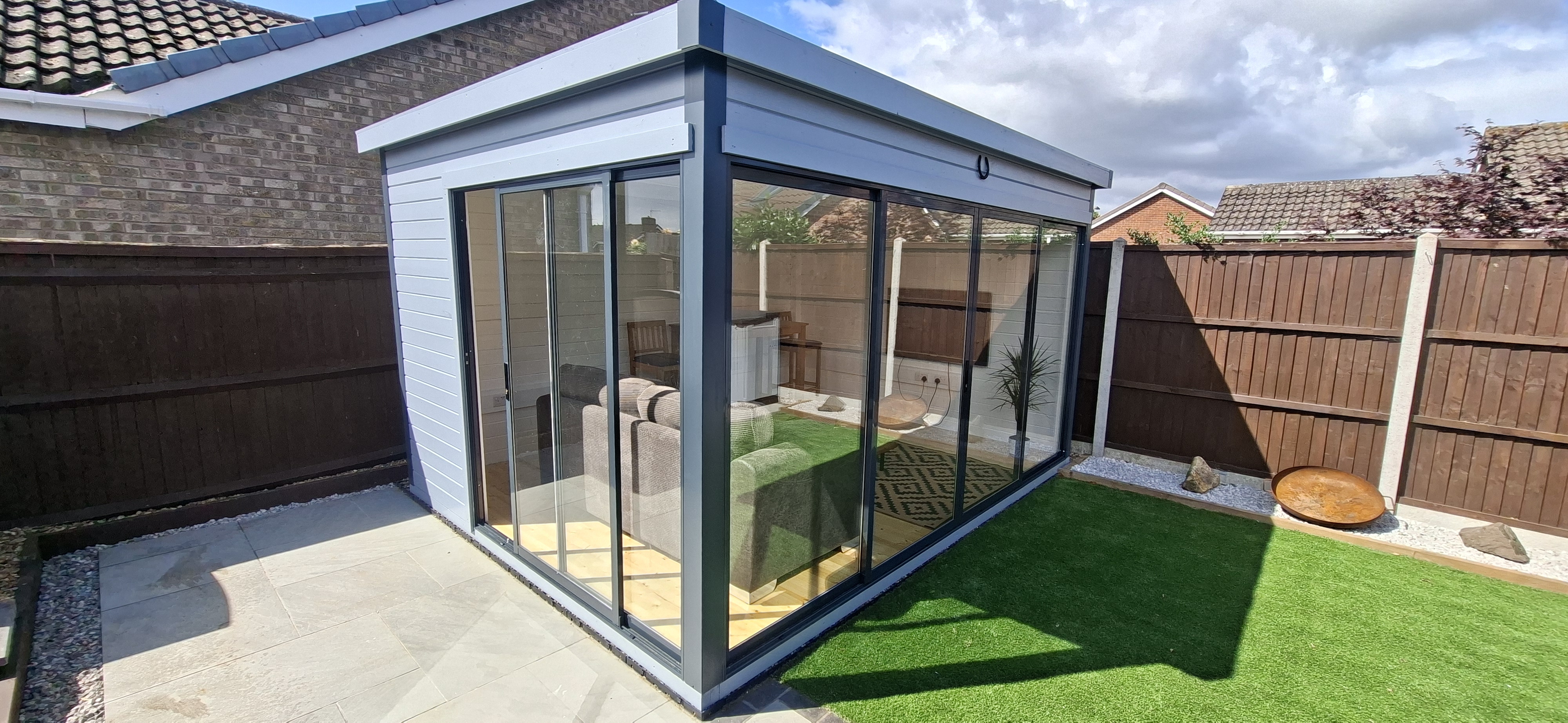 Contemporary garden room with landscaped garden